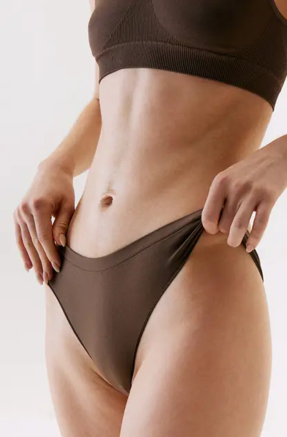 Toned midsection of a woman, representing mommy makeover results